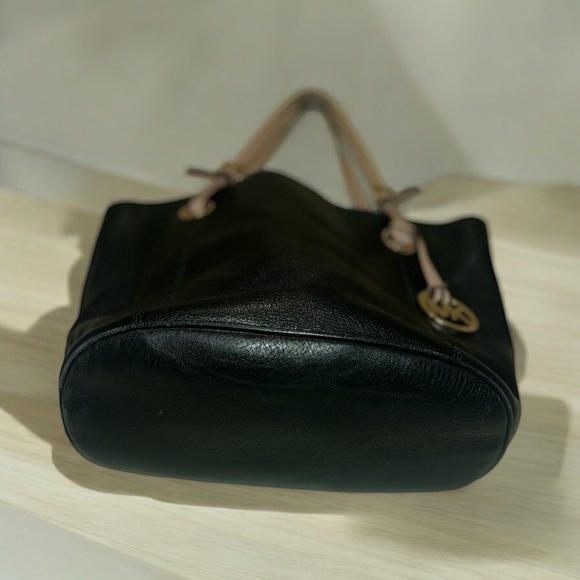 Micheal Kors Authentic black leather with tan straps bucket purse. - Picture 5 of 5